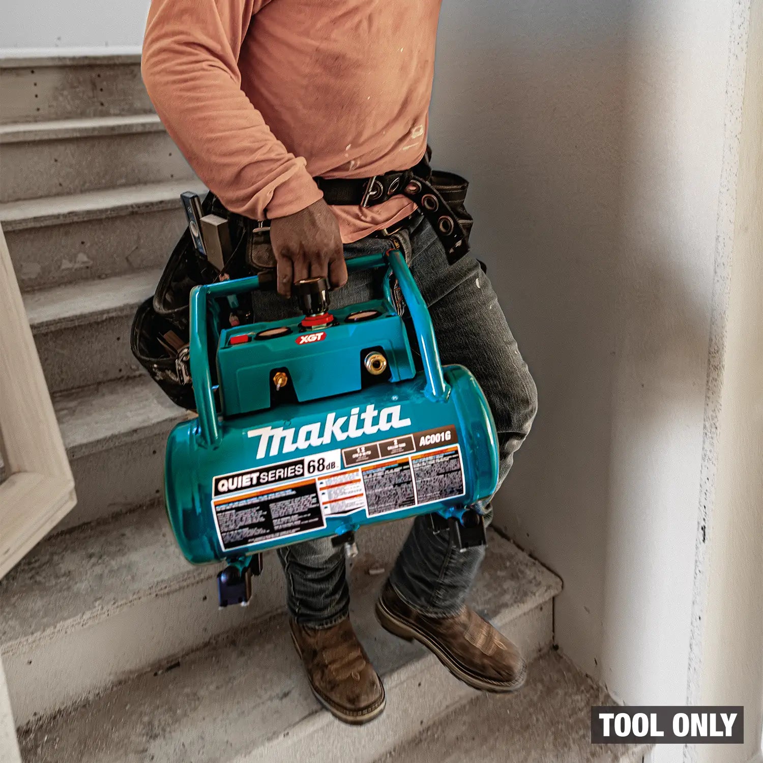 Person holding a Makita tool on a staircase