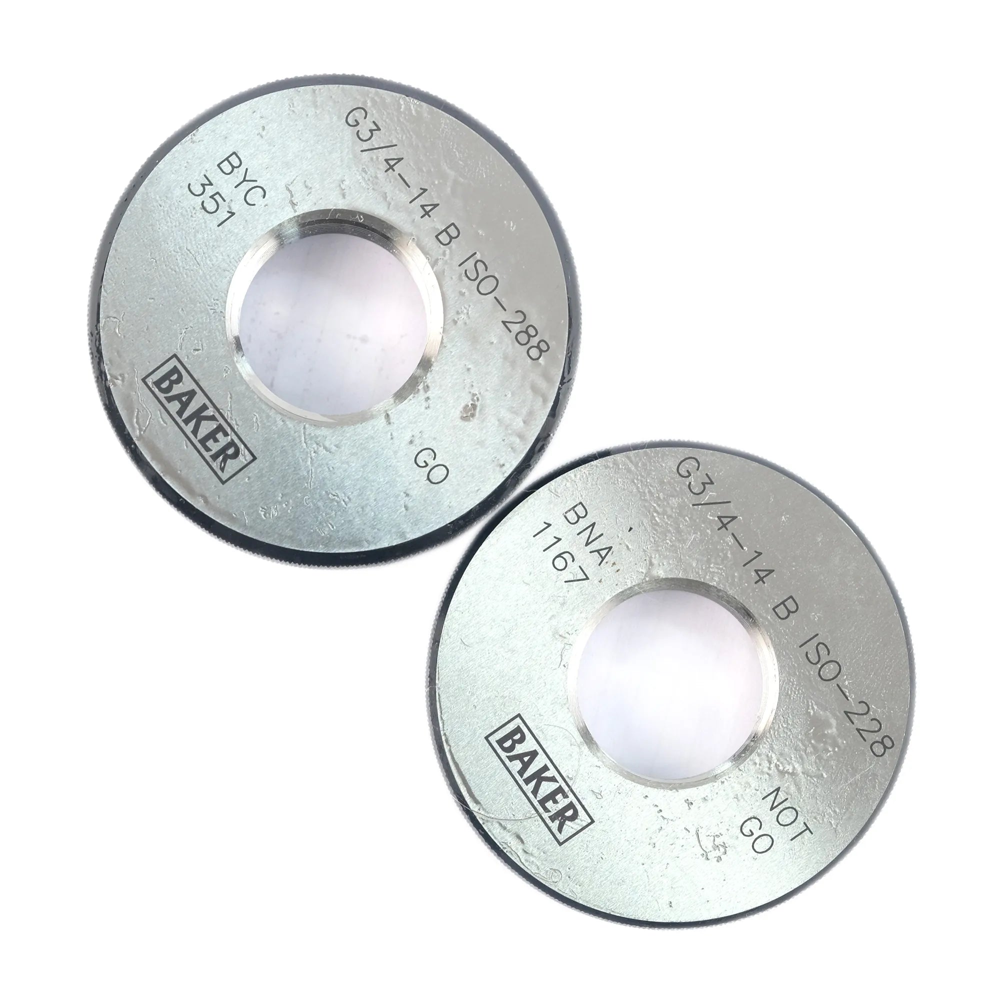 Two circular silver metal filter elements with a central hole, printed with text including 'BAKER' and 'G3/4-14 B ISO-228', on a plain white background.