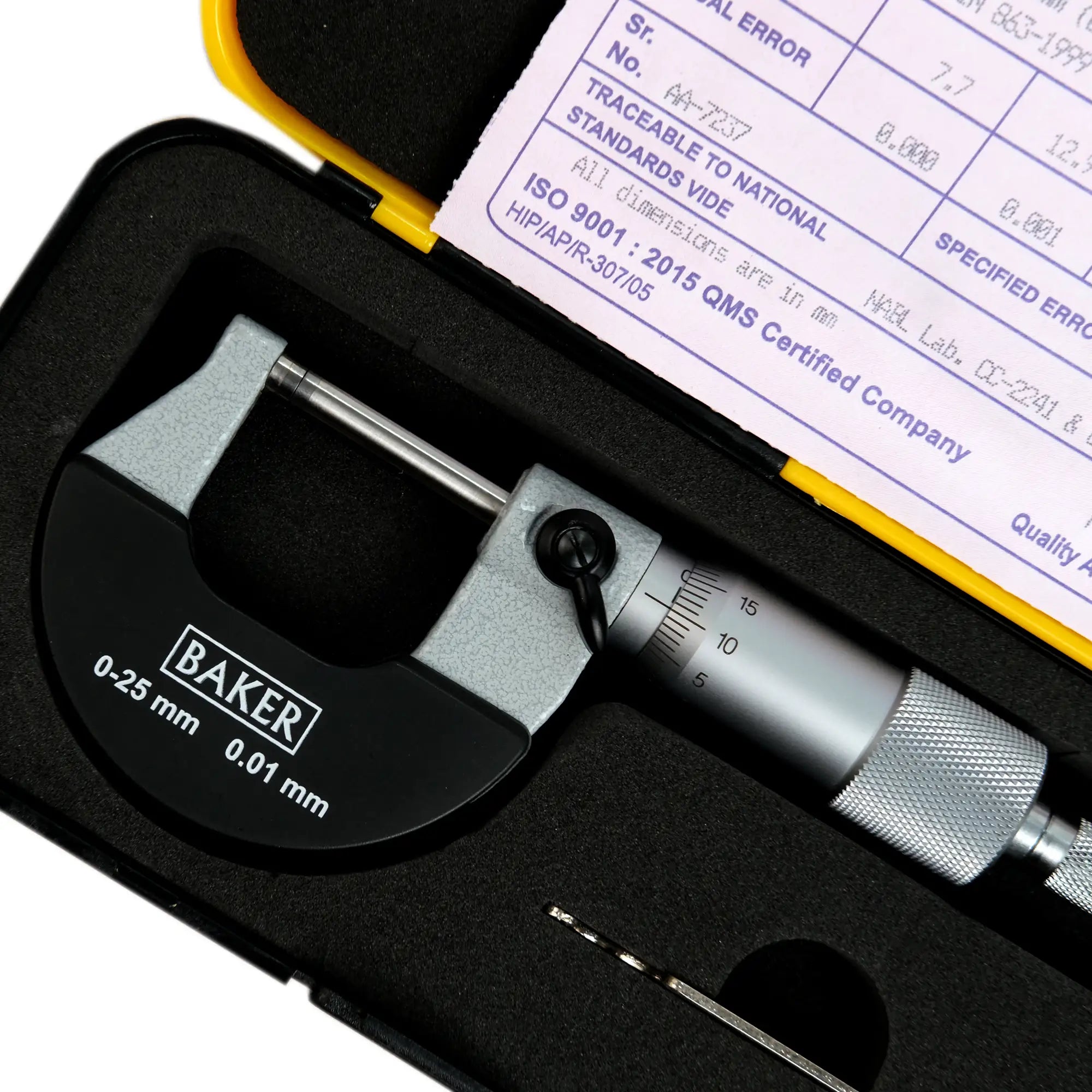 Baker micrometer in a black case with a certification sheet in the background