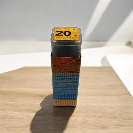 Broach cutter on a wooden surface with a white background