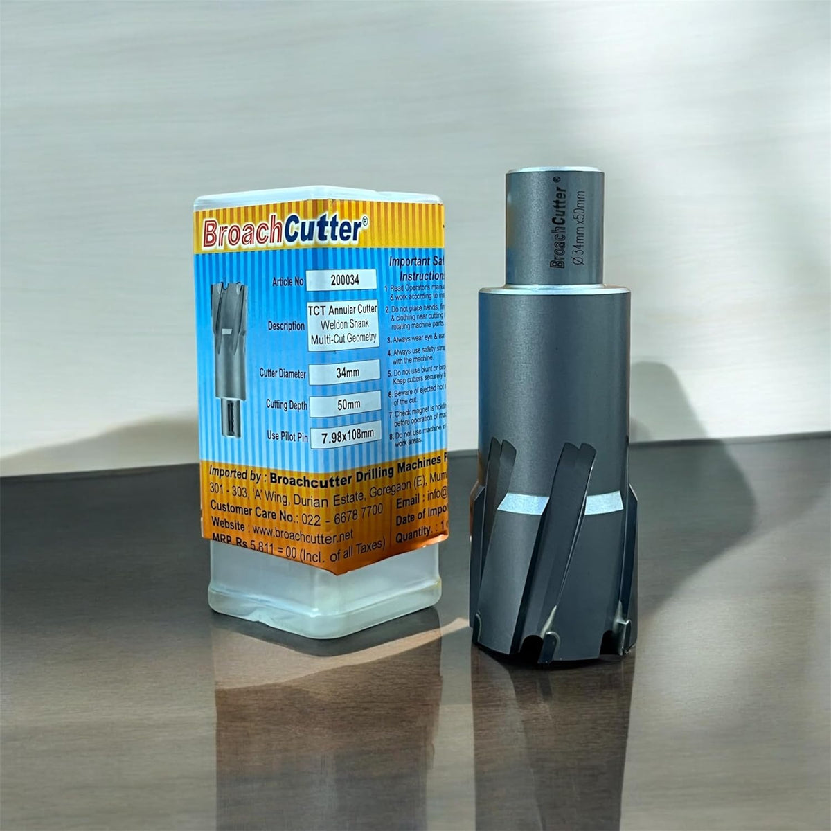 Broach Cutter with packaging on a reflective surface