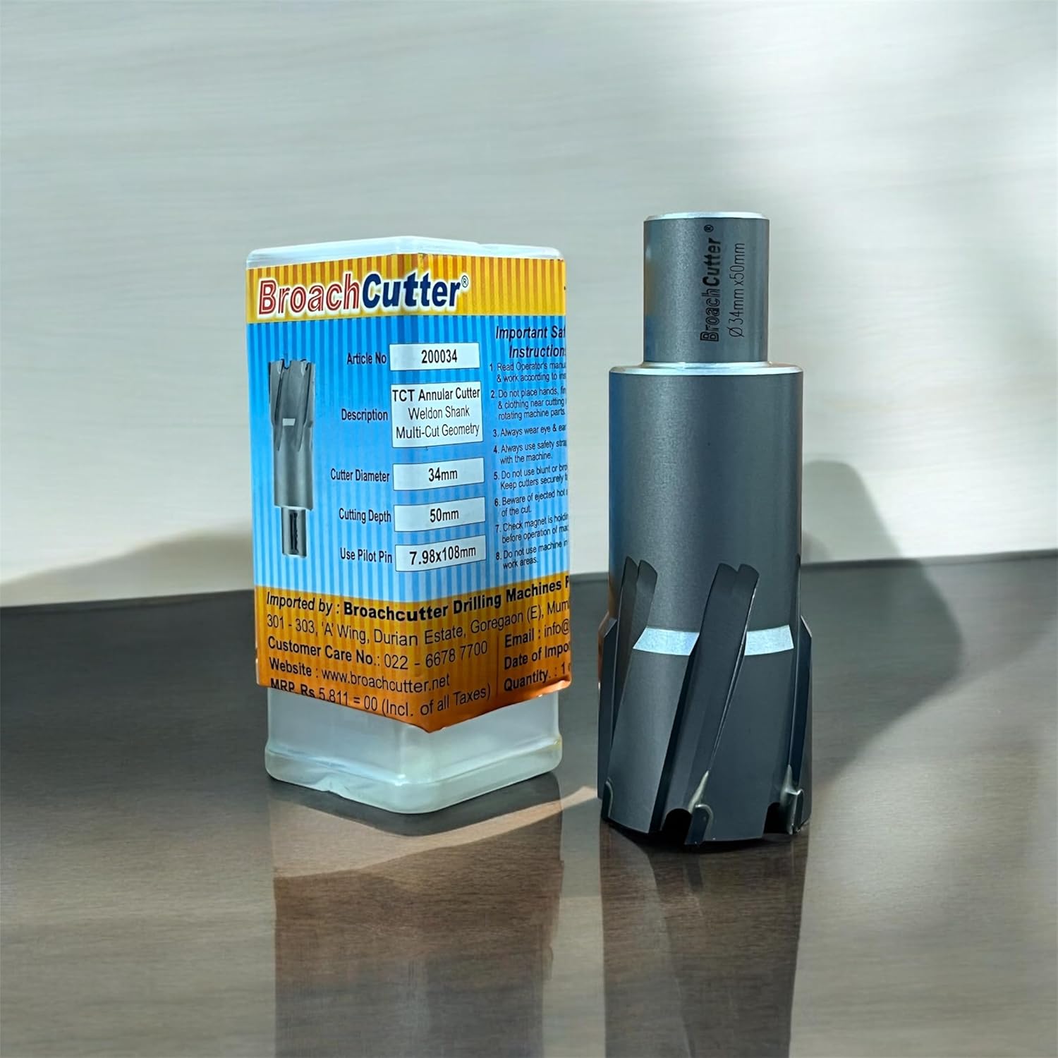 Broach Cutter with packaging on a reflective surface