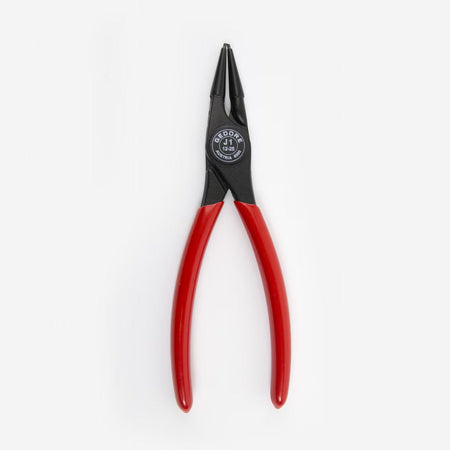 Pair of pliers with red handles on a white background