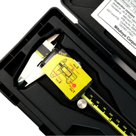 Digital caliper with yellow label in a black case