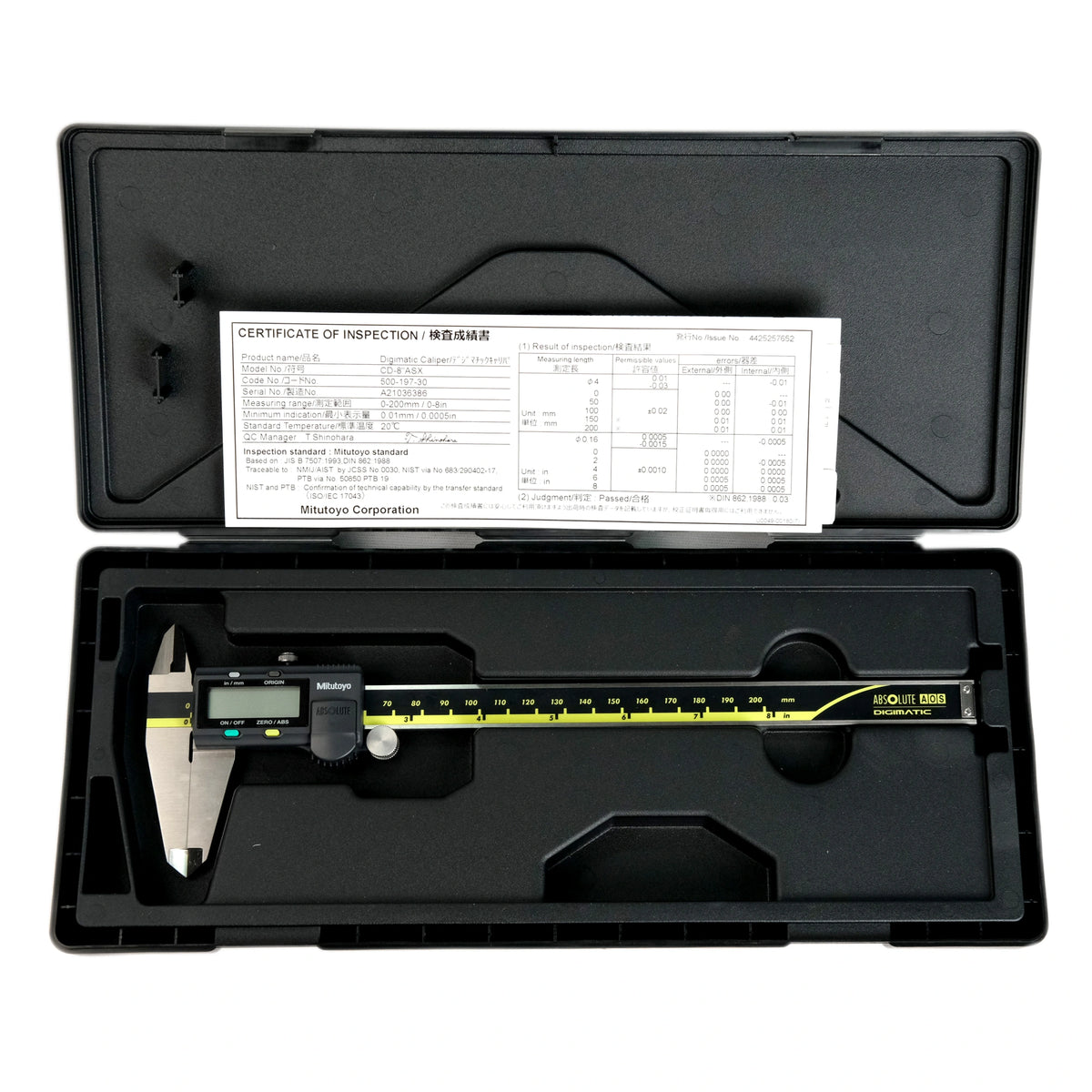 Digital caliper in a black case with a certificate of inspection on top