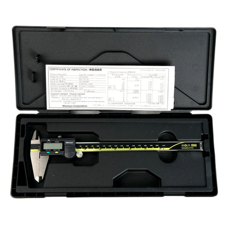 Digital caliper in a black case with a certificate of inspection on top