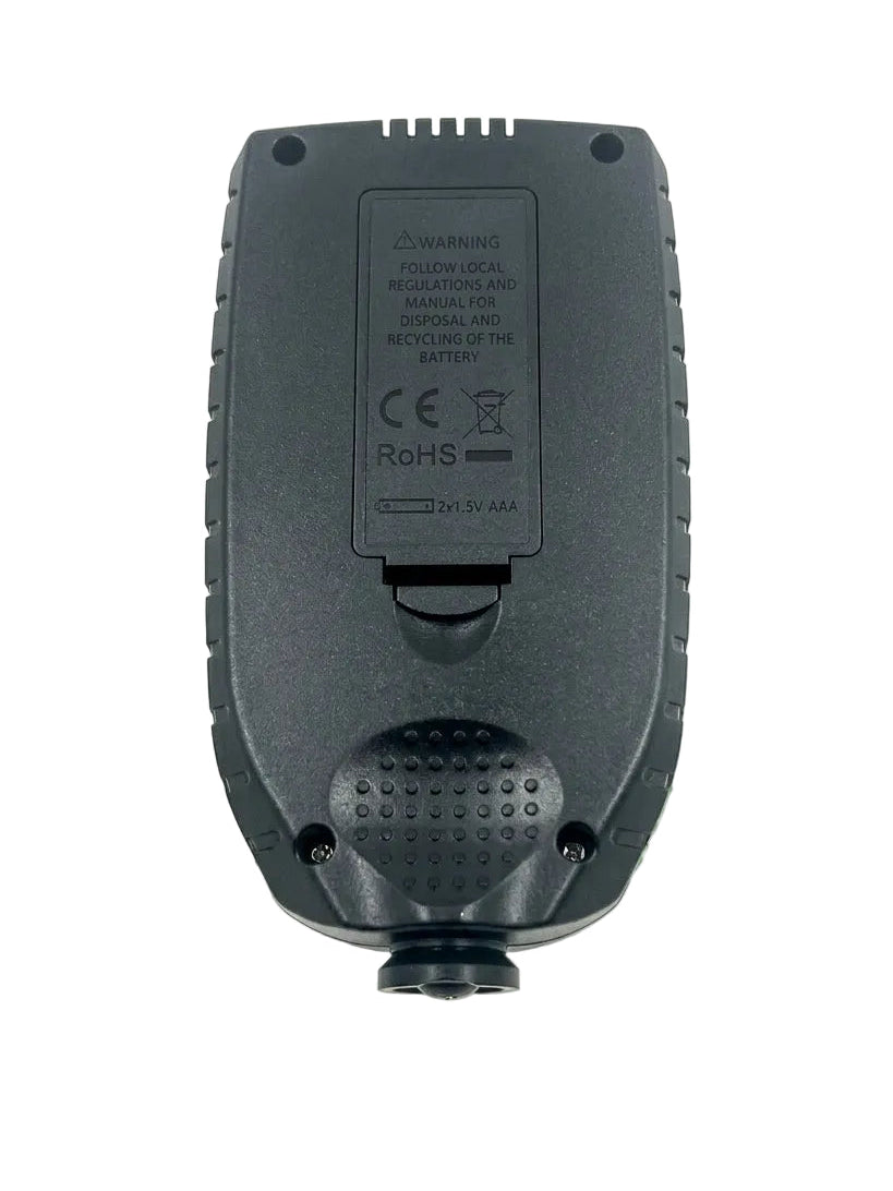 Black electronic device with warning label on a white background